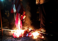 protestors burn flag