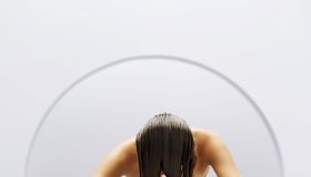 woman washing her hair in a basin