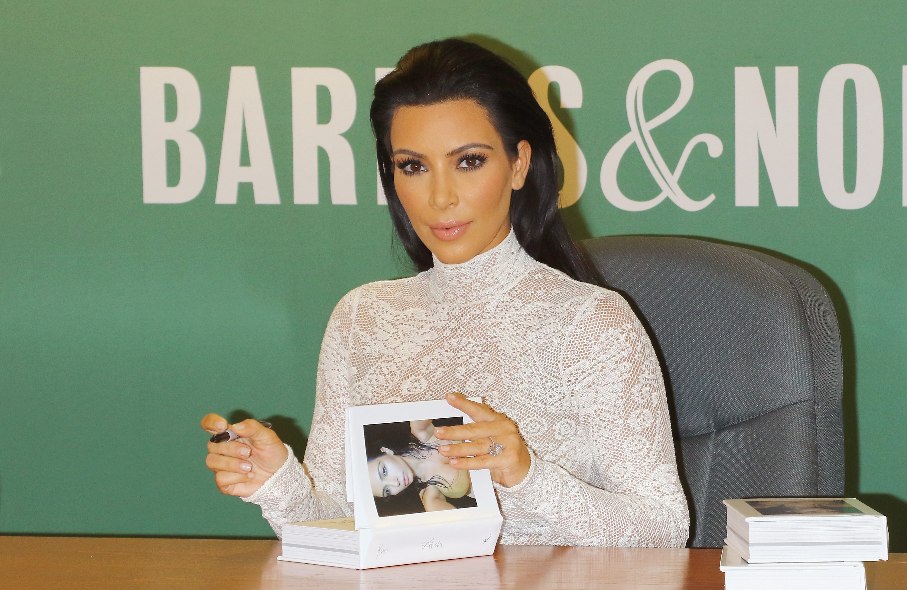 Kim Kardashian Signs Copies Of 'Selfish'