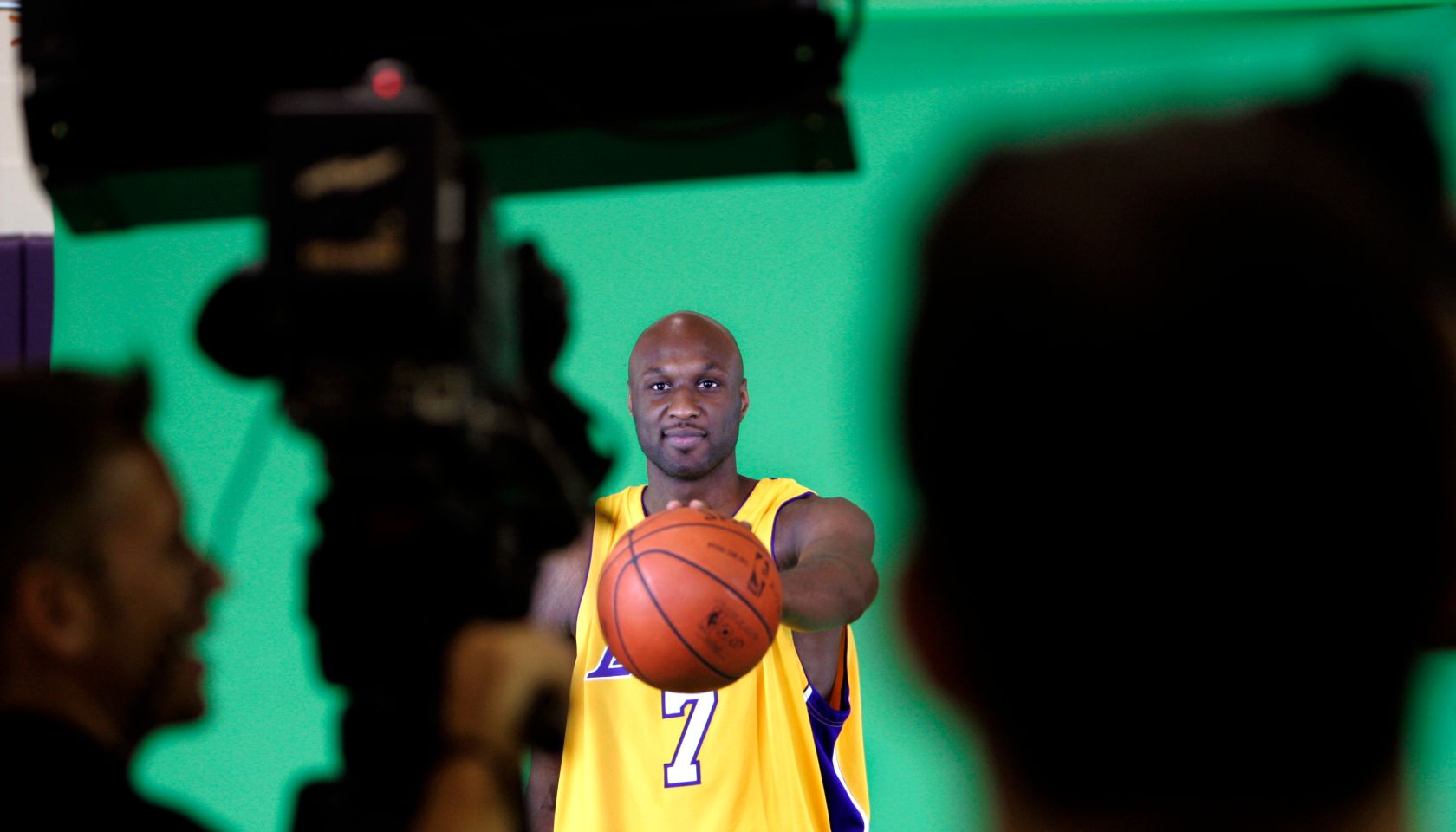 Lamar Odom, forward, for the Los Angeles Lakers, palms a basketball while being videotaped during L