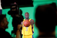Lamar Odom, forward, for the Los Angeles Lakers, palms a basketball while being videotaped during L