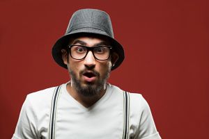 Portrait of young man with surprised expression