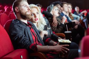 Young people in 3D movie theater