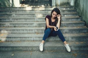 Girl crying on stairs