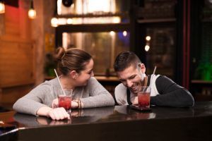 Happy young couple enjoying in cafe bar