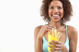 Woman Eating French Fries