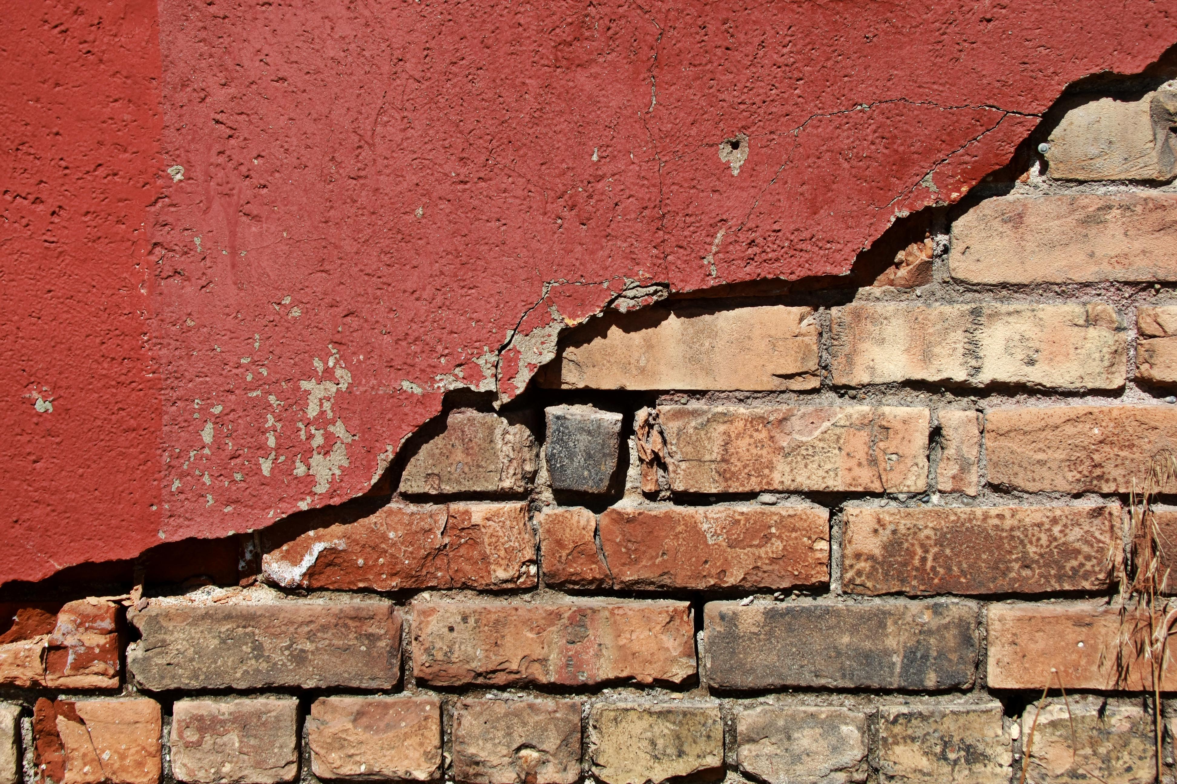 Grunge Brick under Red Plaster