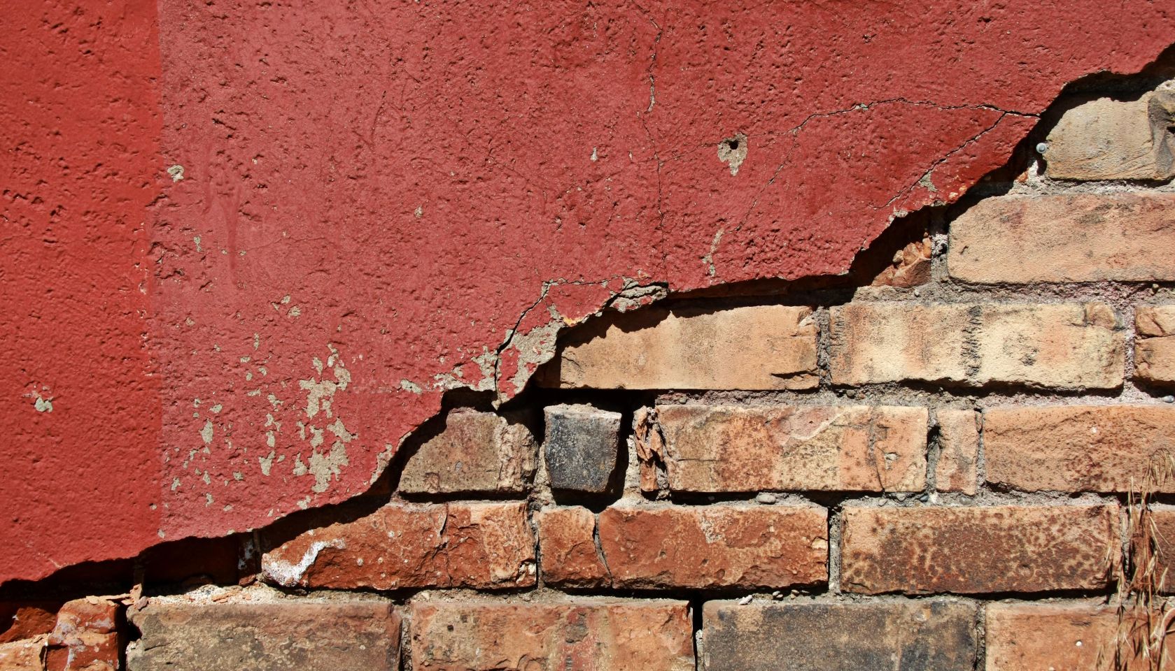 Grunge Brick under Red Plaster
