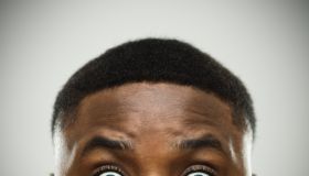 Close-up portrait of african man shocked