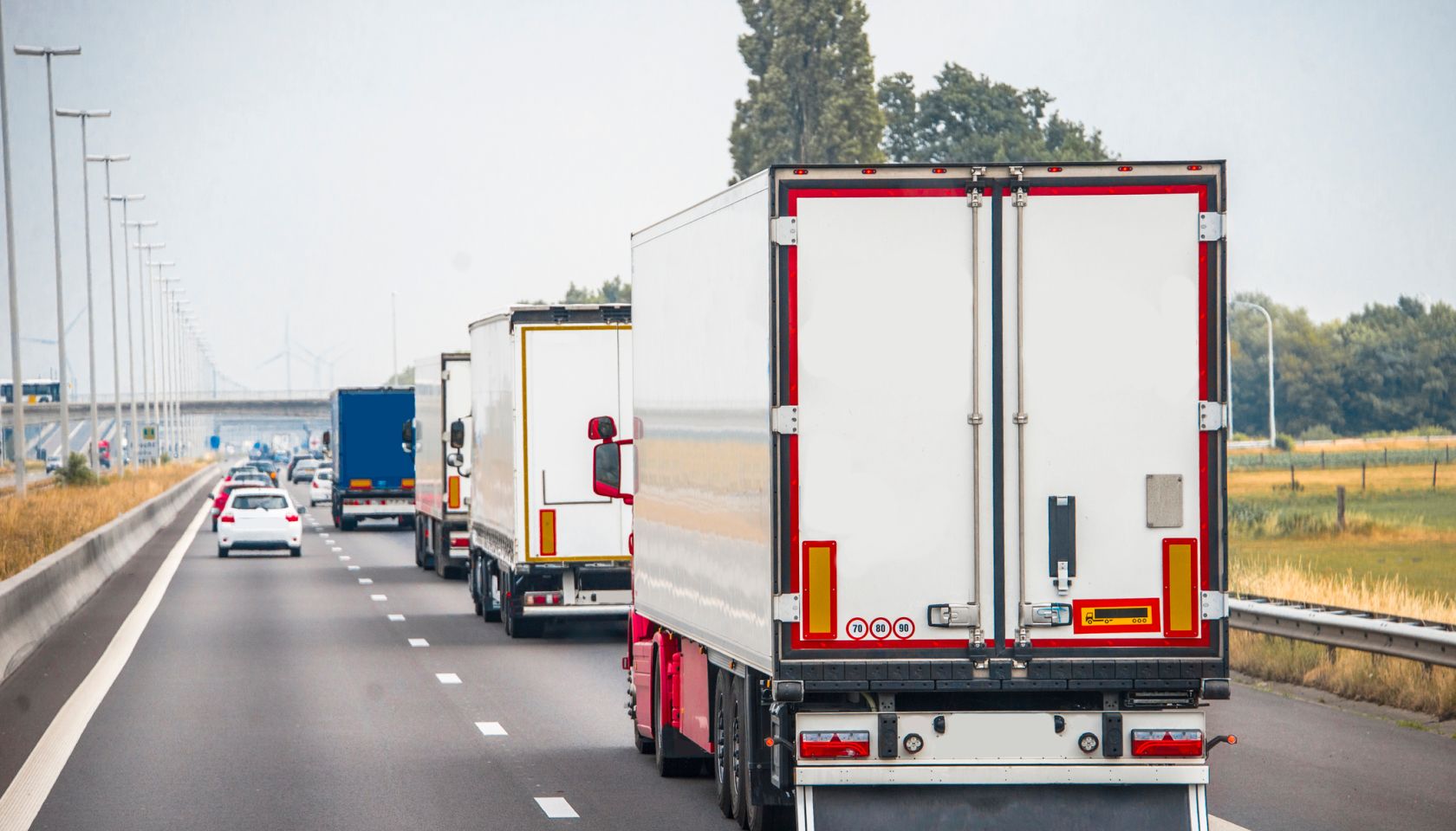 Trucks in a row on a highway