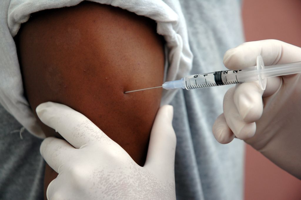 A man receiving a vaccine shot