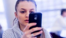 Portrait of young woman using smartphone