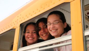 Middle school students on a school bus at the Drug Free Youth In Town, Awards Luncheon at Hyatt Regency Hotel.