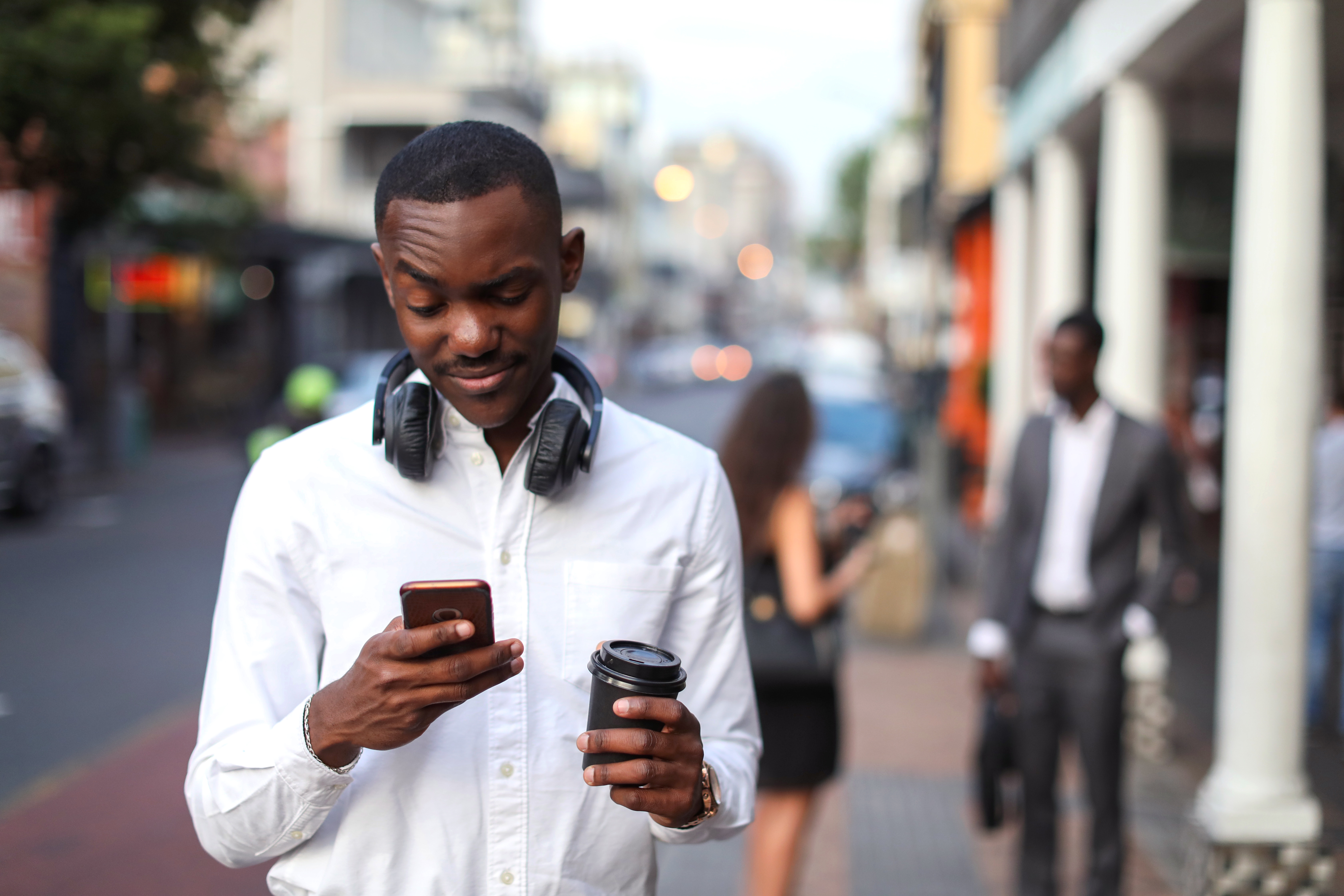 Portrait of a young man at the bus stop.