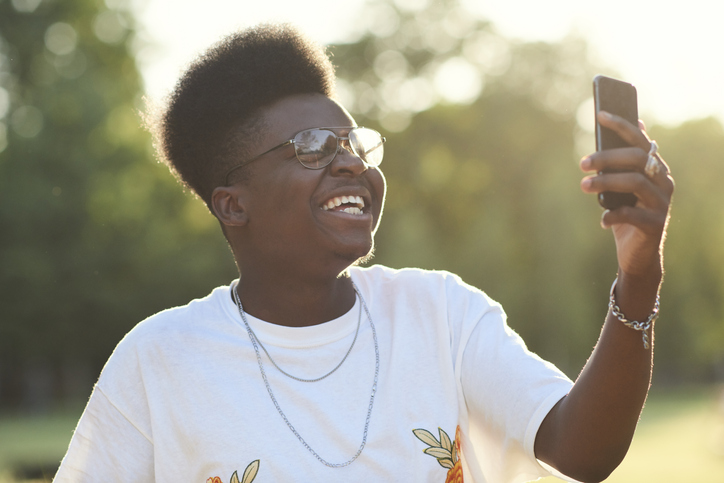 Man having fun taking a selfie with a smart phone