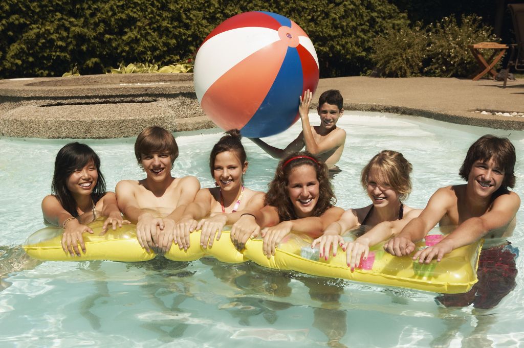 Teenagers in swimming pool