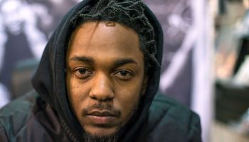 Kendrick Lamar Signs Copies Of His New Album "To Pimp A Butterfly"