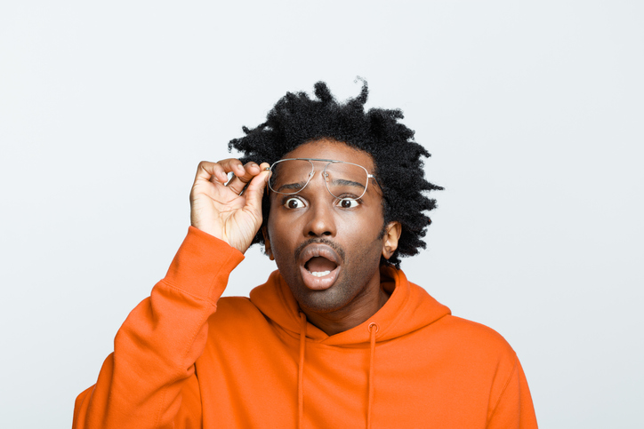 Shocked man in orange hoodie