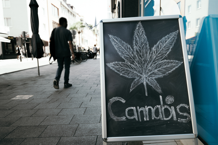 Сannabis leaf sign outside a coffeeshop on the street in Europe