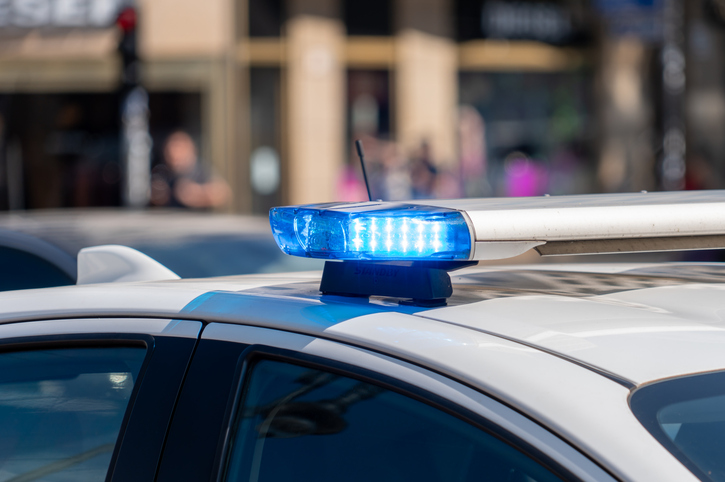 Blue flash light on top of police car