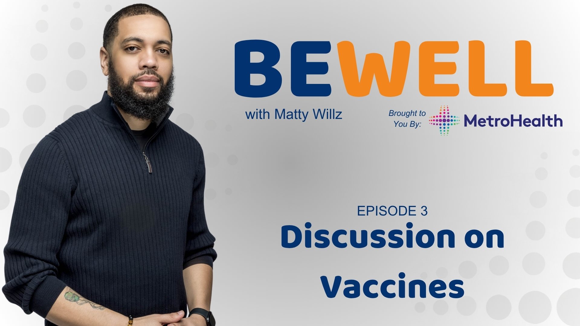 A man with a beard wearing a black sweater stands in front of a backdrop with the text "BE WELL with Matty Willz" and the MetroHealth logo.