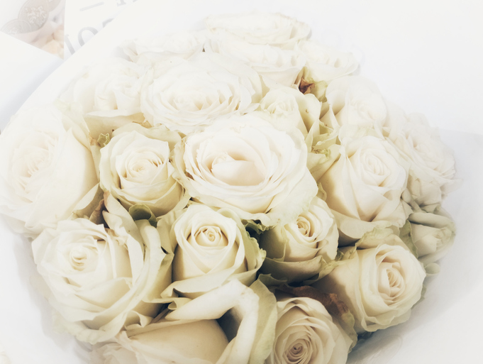 Beautiful white roses arranged in an elegant celebration bouquet